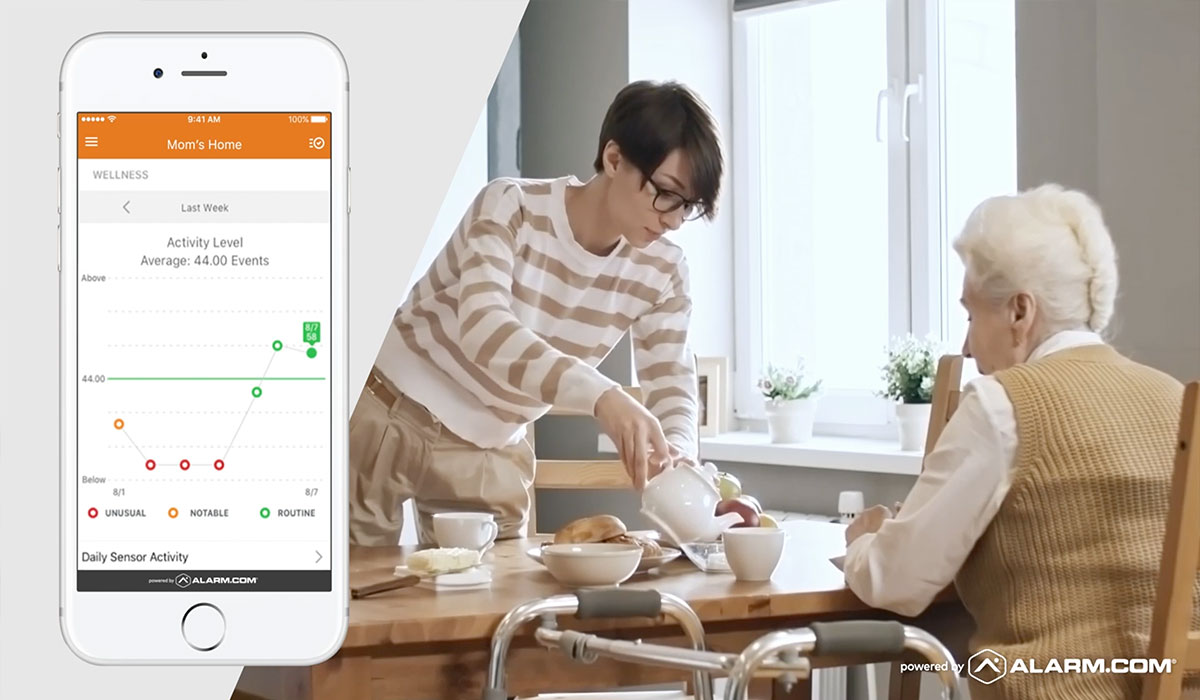 woman helping her mother pour tea and alarm.com app
